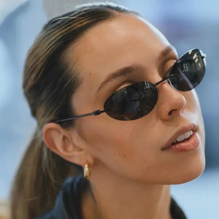 Lightweight unisex oval sunglasses – rimless design, high-quality plastic, for beach and city